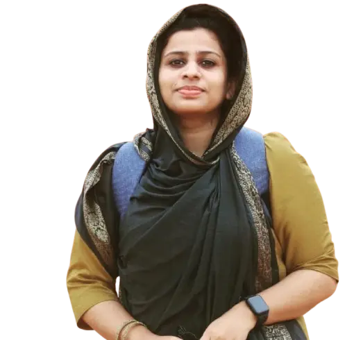 Freelance digital marketer in Malappuram wearing a dark green hijab and mustard outfit, standing confidently with a backpack and smartwatch, looking at the camera with a pleasant smile.